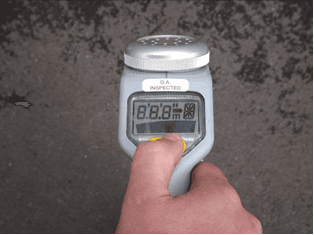 Hand holding a CAT4 with every display segment lit (8.8.8) during the power-on self-test.