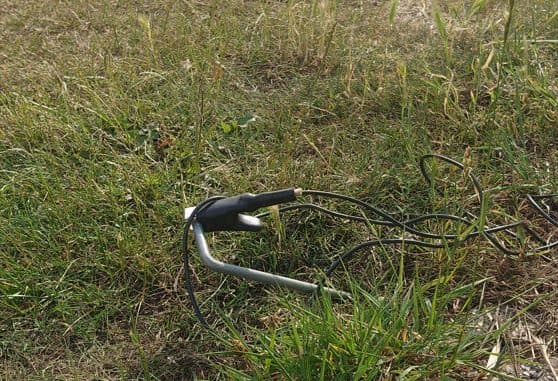 Earth pin in grass at a shallow angle with the Genny's earth lead clipped on.