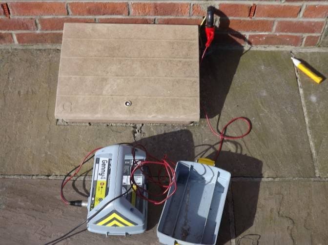 Genny connected at a property's service position, seen from above.